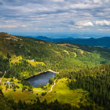 Vosges mountains summer landscape from the Gazon du Faing overlooking at the Forlet lake (or "Lac des truites"), France.